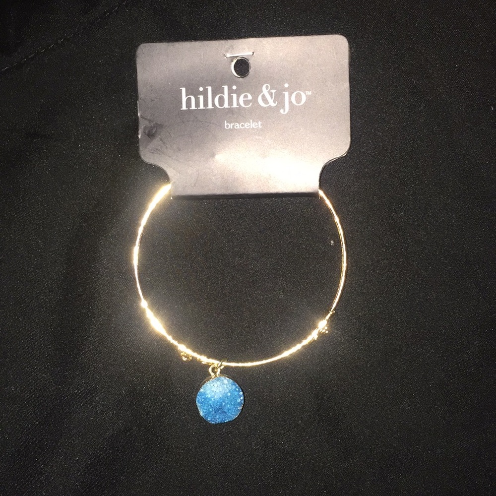Gold charm bracelet with turquoise crystal stone